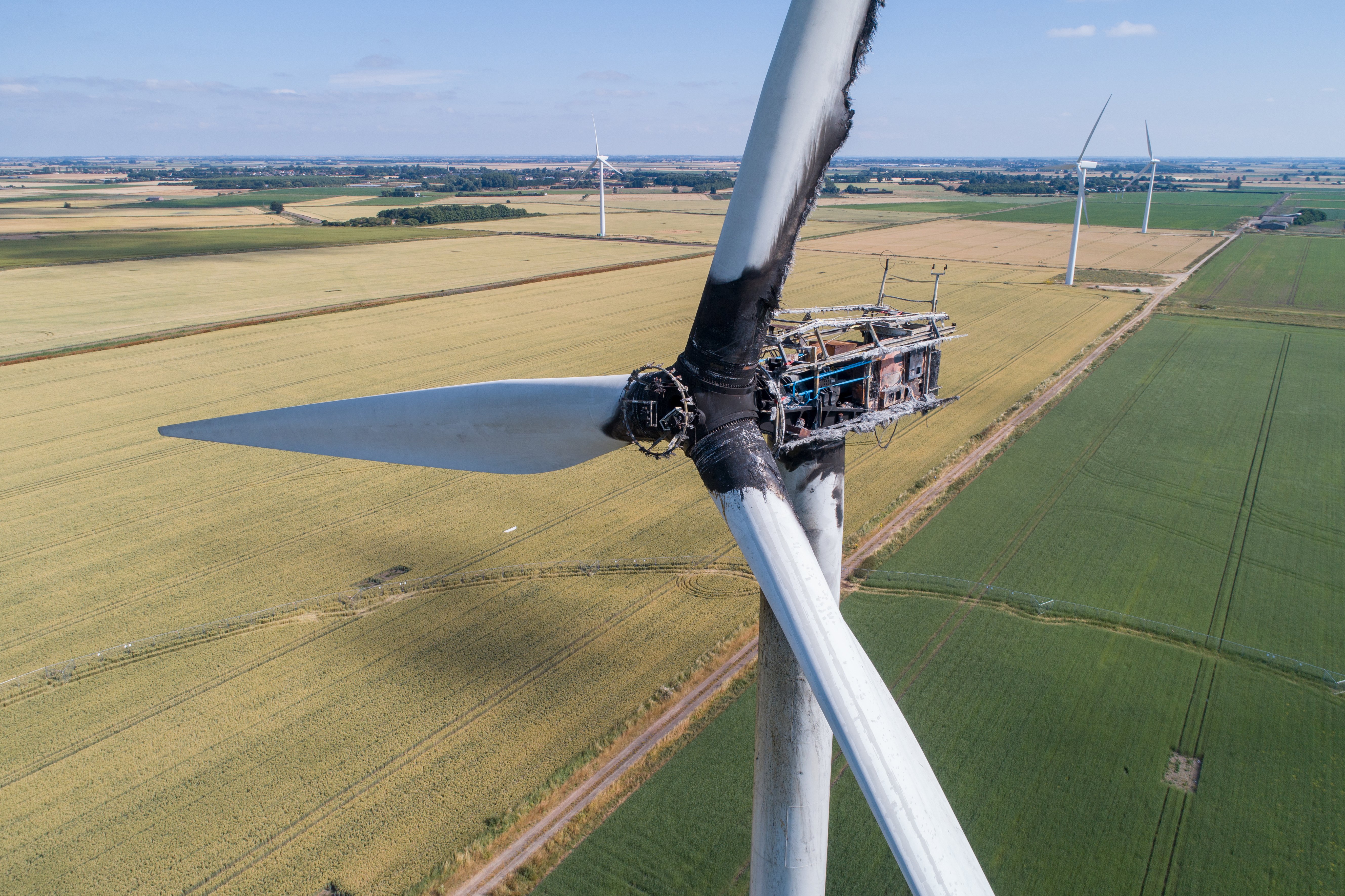 Wind turbine damaged by fire after lightning strike_shutterstock_1368464126