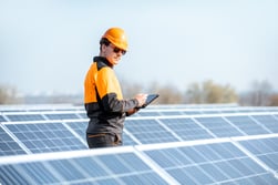 engineer-servicing-solar-panel-on-electric-plant-2022-02-01-22-36-46-utc