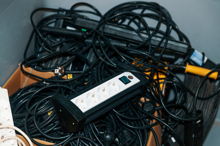 pile-of-cables-with-surge-protector-on-top