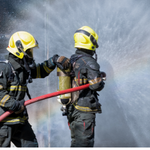 two-firemen-extinguishing-fire