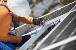 worker-installing-photovoltaic-panel-system