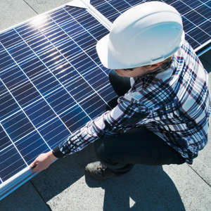 worker-installing-solar-farm